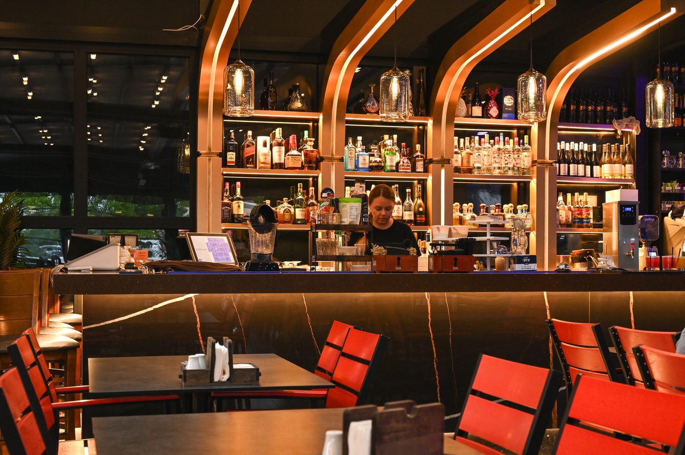 The warm, arched golden bar