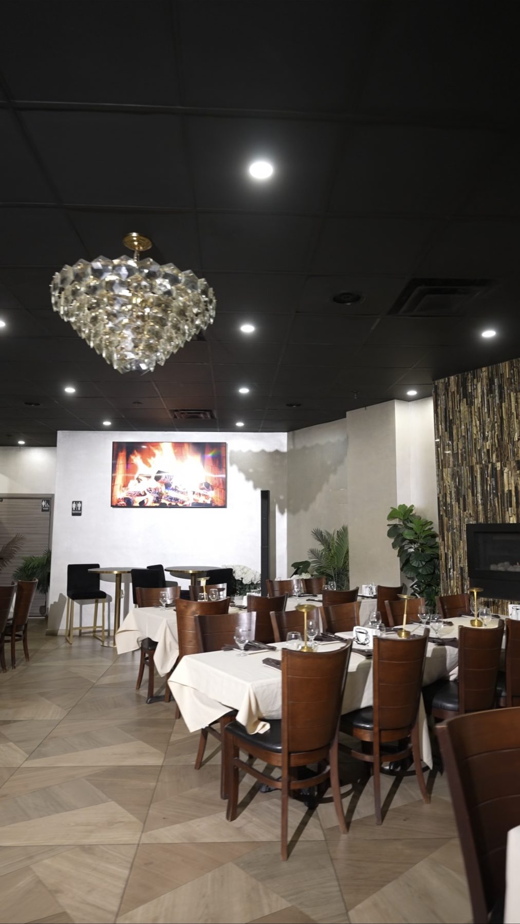 Crystal chandelier and stone wall