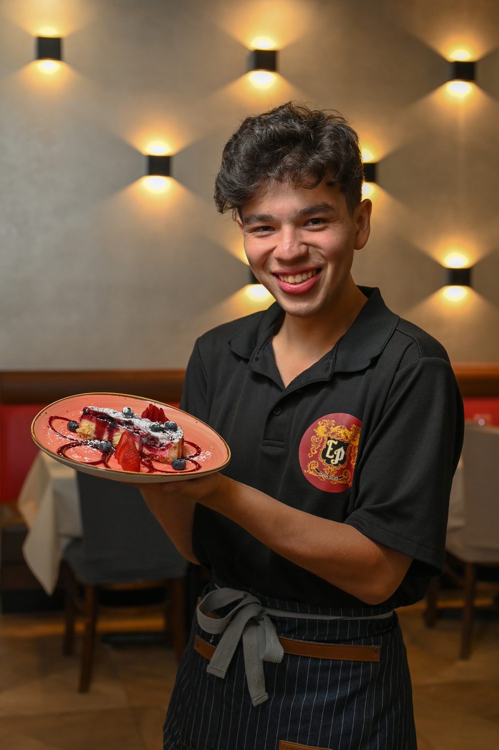 Server presenting a dessert plate